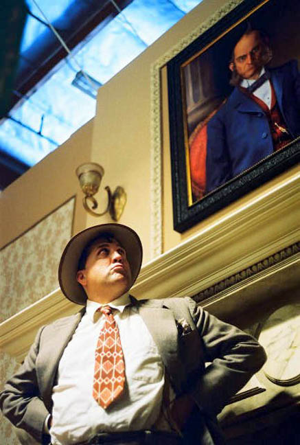 Here's my portrait of the patriarch of the Cavinder family, Sinas Cavinder, as it was placed on the wall of the amazing mansion set created by production designer Anthony Tremblay. Quizzically regarding the portrait is veteran actor Daniel Roebuck as reporter "8 O'Clock Farraday." Photograph courtesy Robert Deveau.